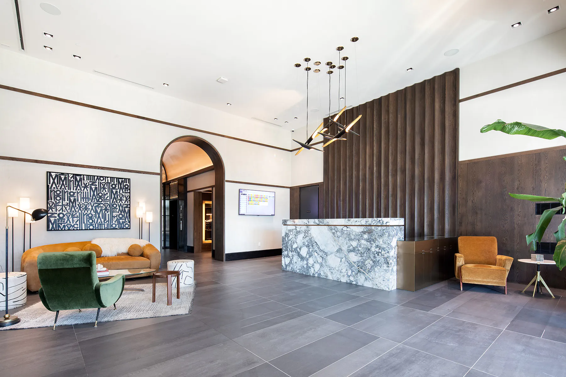 Bright, large, modern lobby with high ceilings, seating, and modern decor